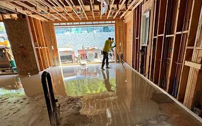 Self-leveling concrete application for smooth luxury flooring by R Builders