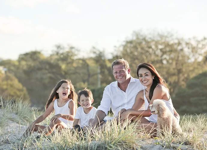 Happy family outdoors enjoying their new home