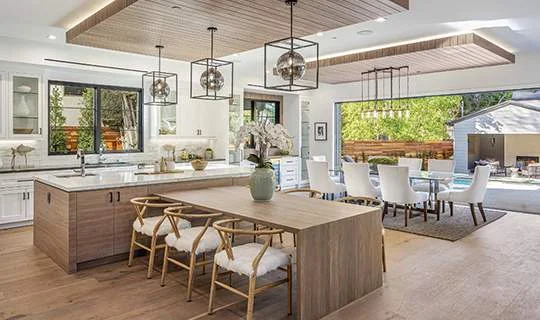 Kitchen remodel with fluted cabinetry and Taj Mahal stone